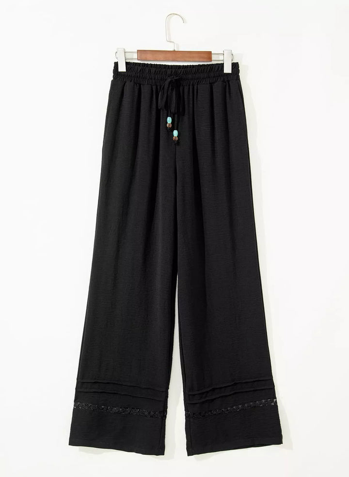 Wide leg drawstring pants with embroidered lace hem