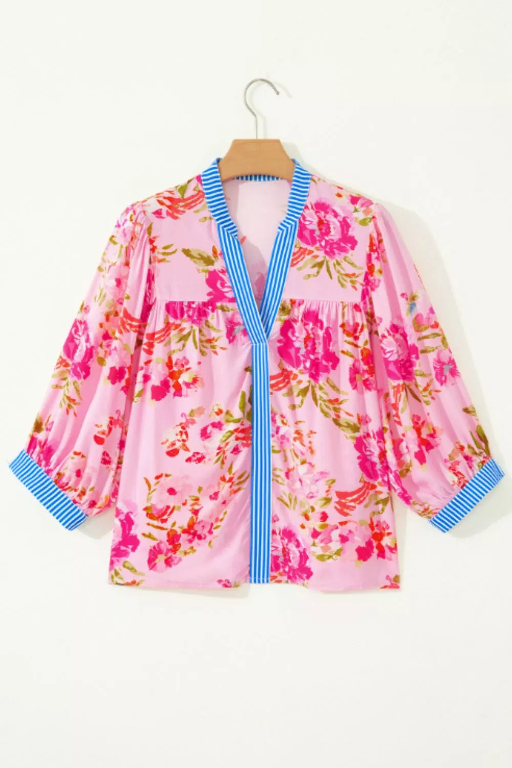 Floral relaxed blouse with striped V-neck and cuff trim