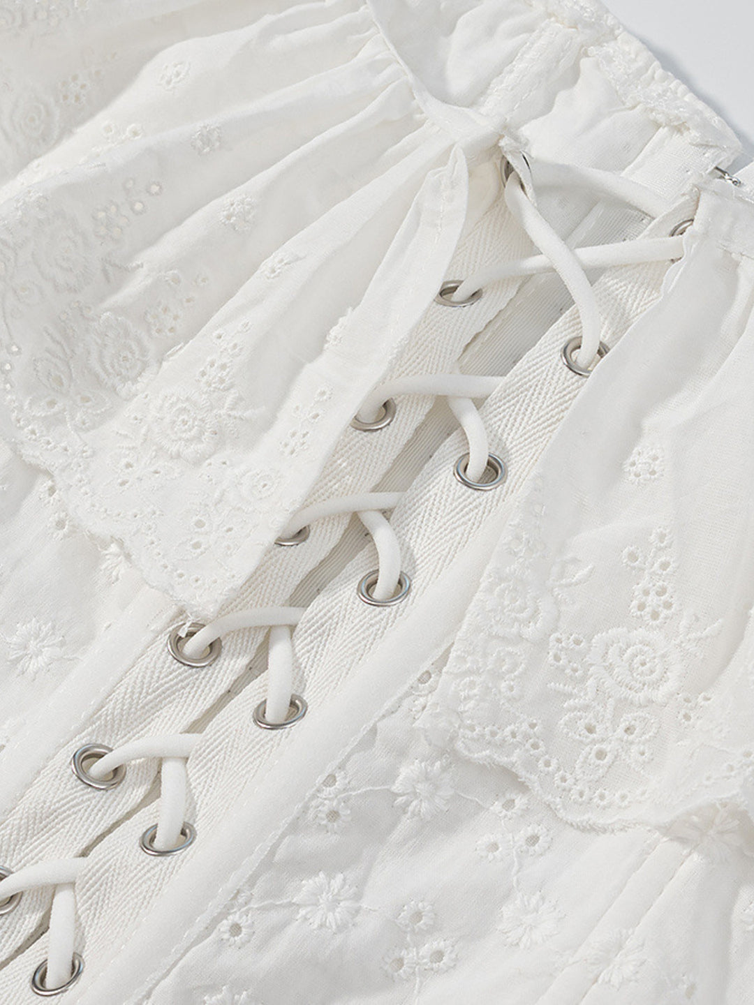 Eyelet ruffle-trim corset tank top with lace-up back