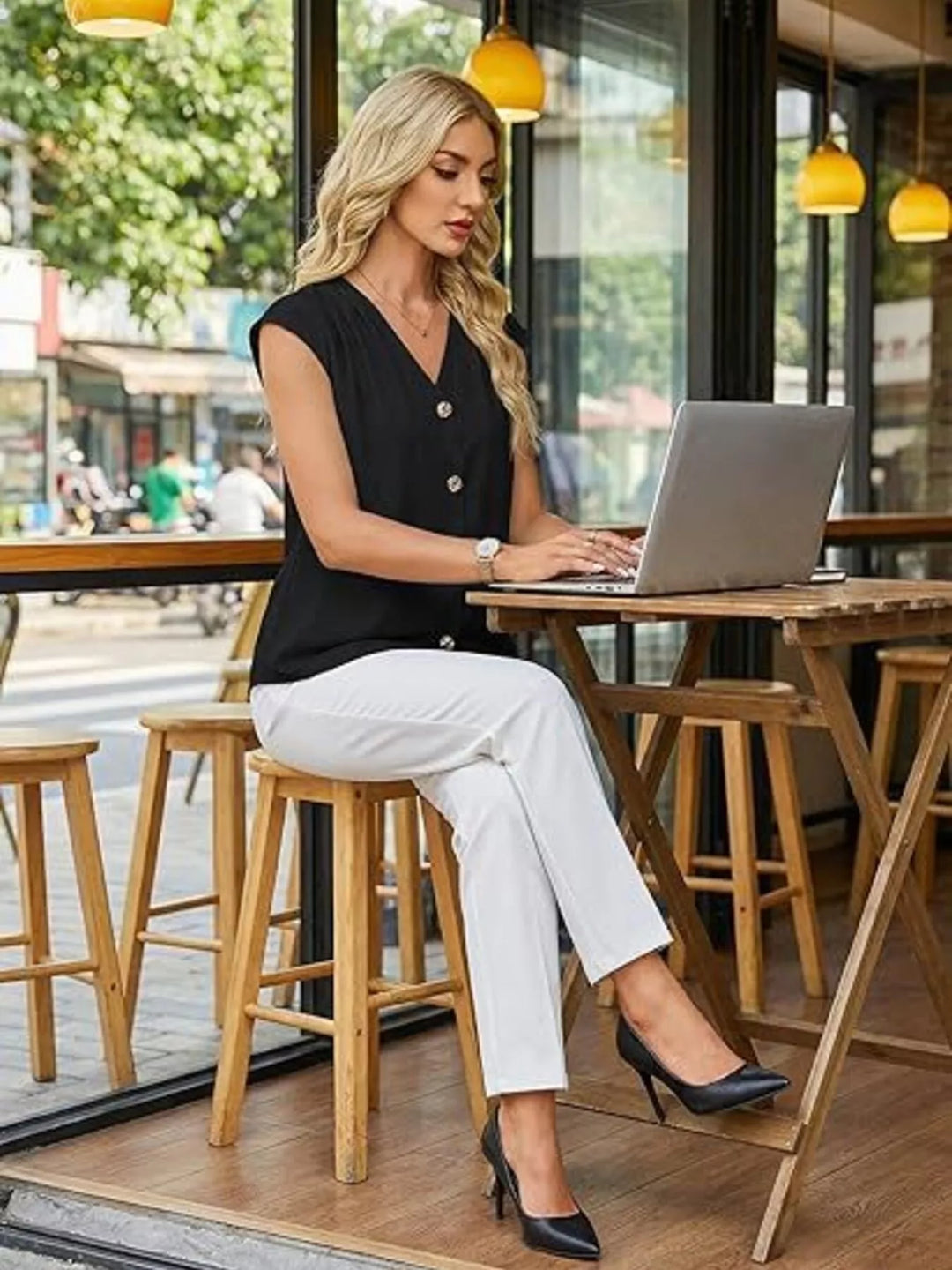 Black V-neck cap sleeve button-front blouse with pleated shoulders