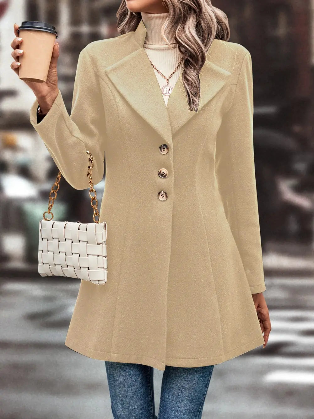 Button-front longline coat with notched lapel and flared hem