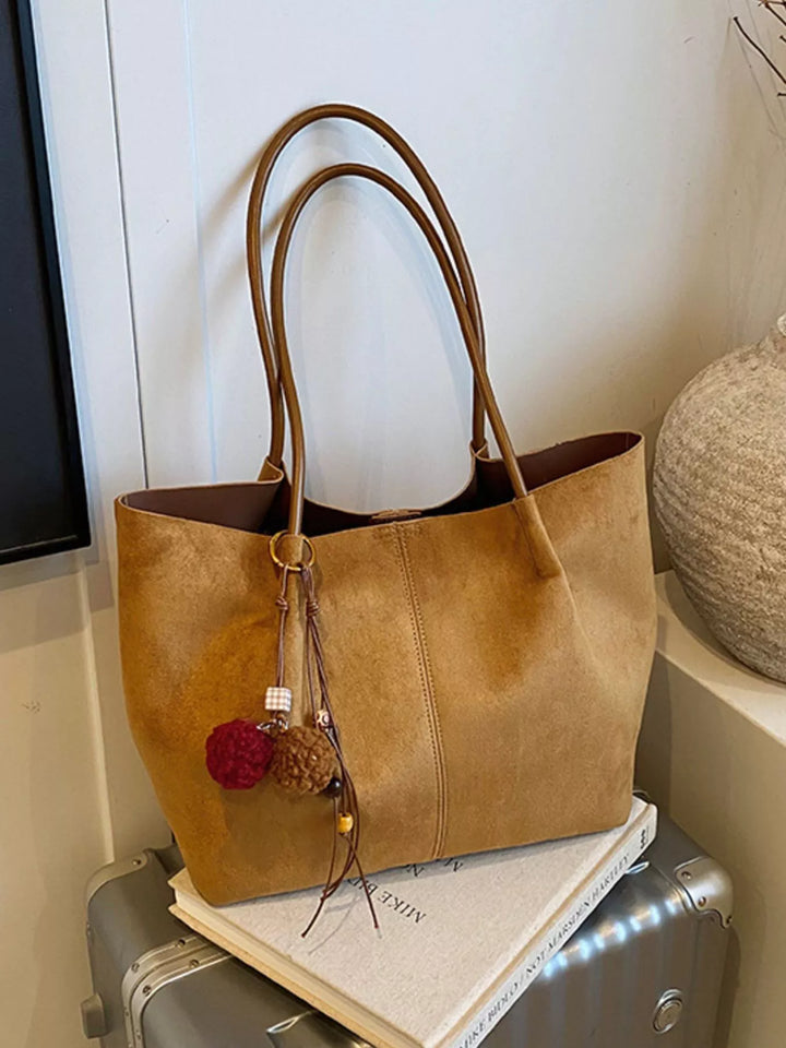 Large slouchy suede shoulder tote bag with pom charm