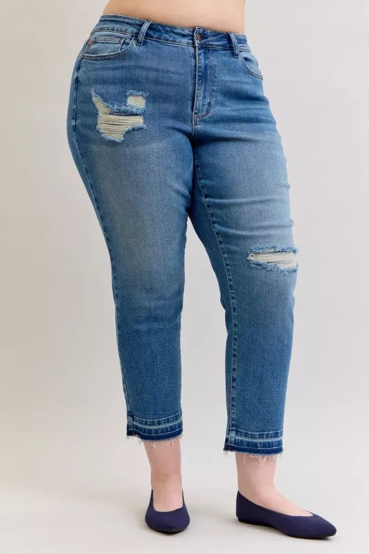 Distressed mid-rise boyfriend jeans with released raw hem