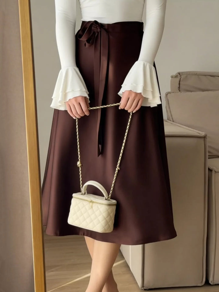 High-waist satin A-line midi skirt with tie bow