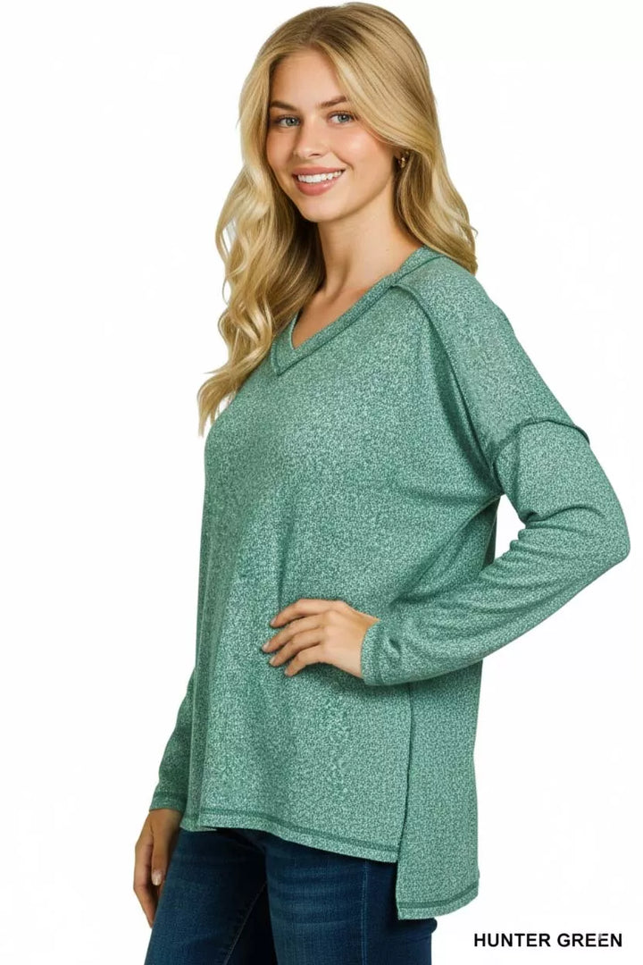 Melange hacci exposed-seam V-neck long sleeve top