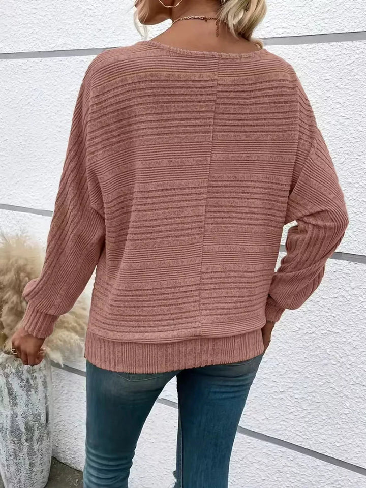 Ribbed knit quarter-zip batwing sweater with O-ring pull