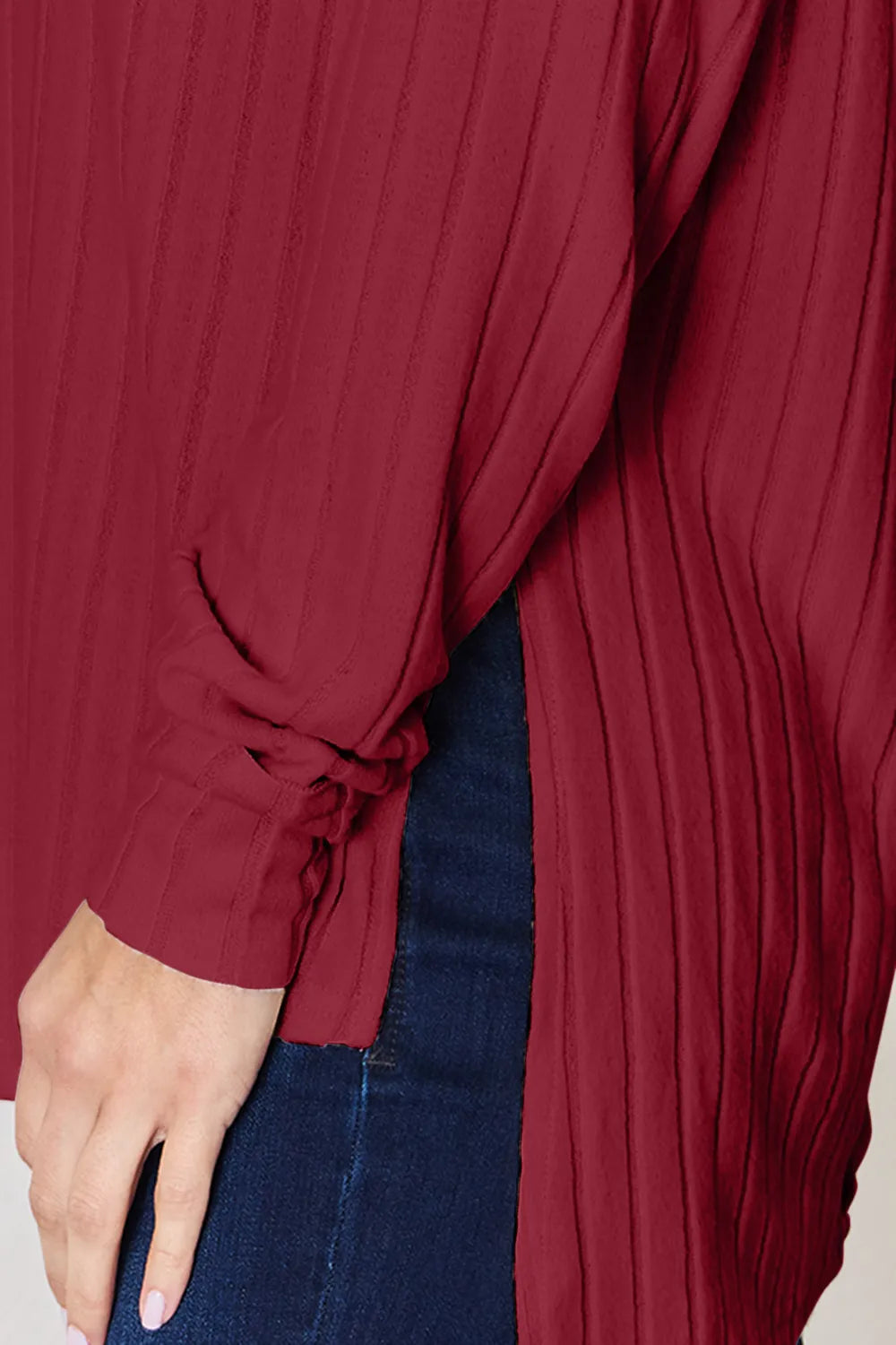 Ribbed knit round neck long sleeve top with side slits