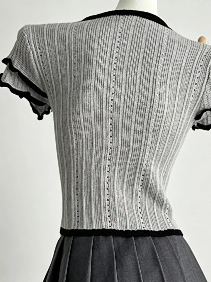 Ribbed knit crop top with Peter Pan collar and ruffle sleeves