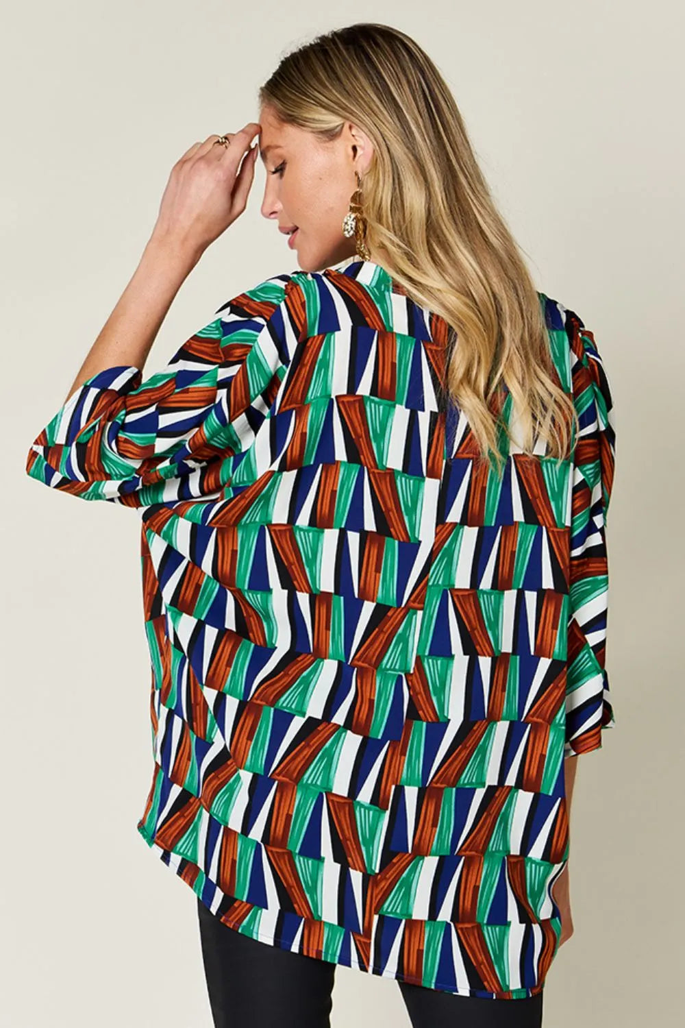 Geometric print notched neck dolman sleeve top