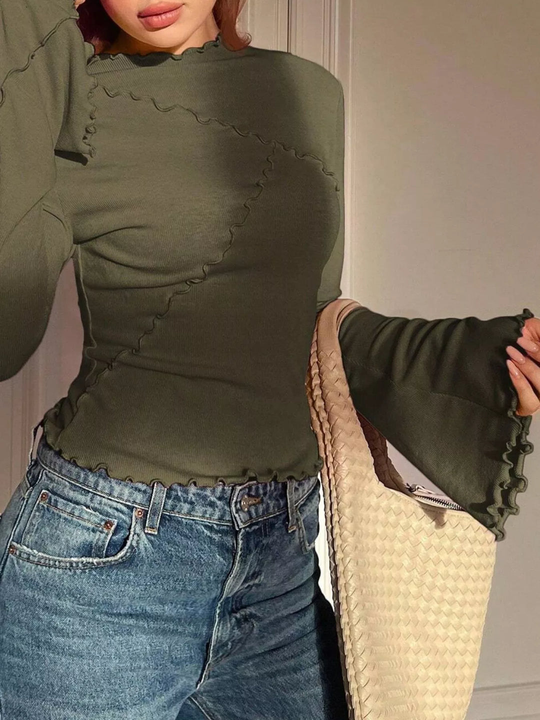Ribbed knit mock neck top with lettuce-edge flare sleeves