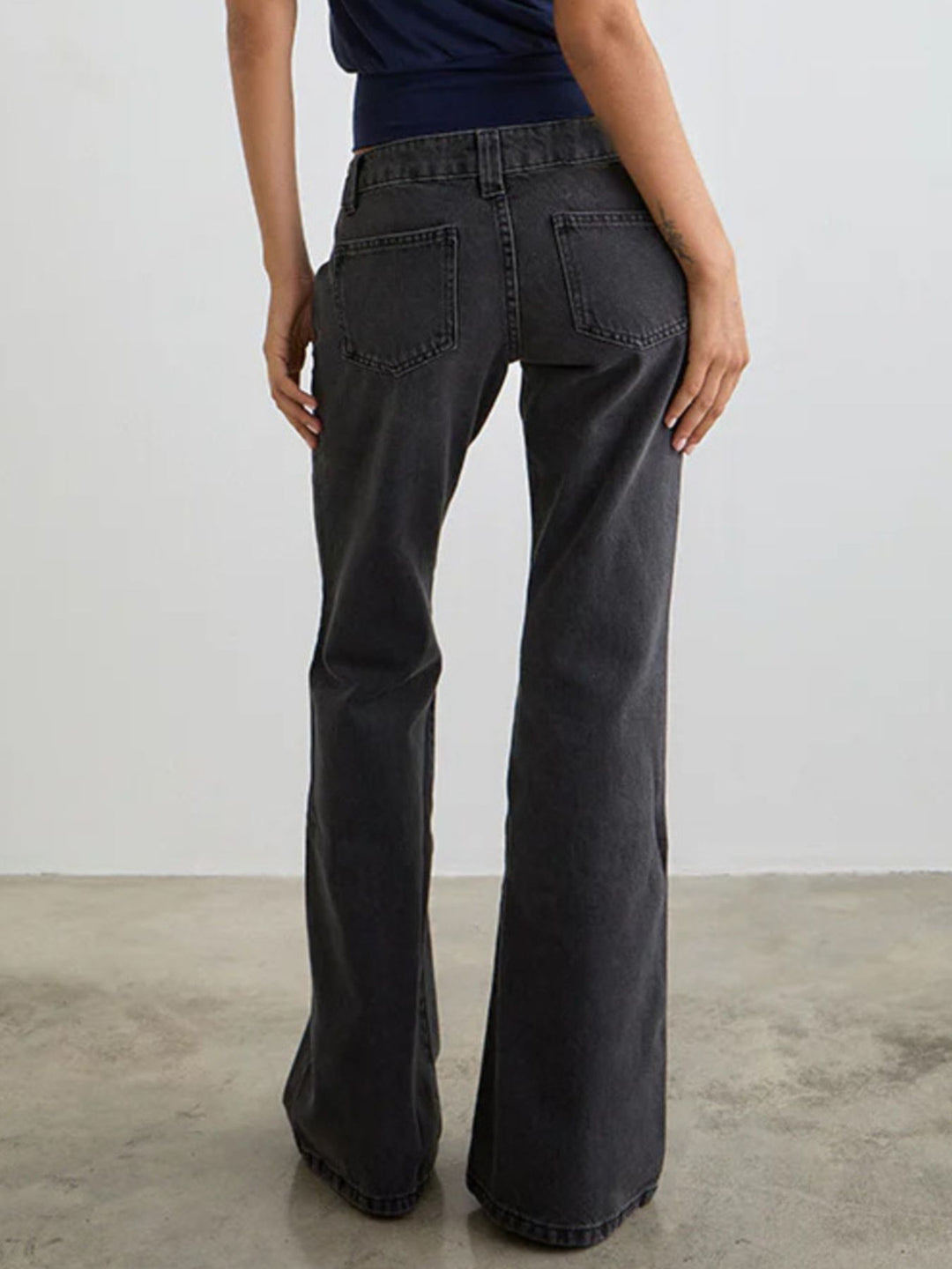 Low-rise washed denim flare leg jeans with 5-pocket styling