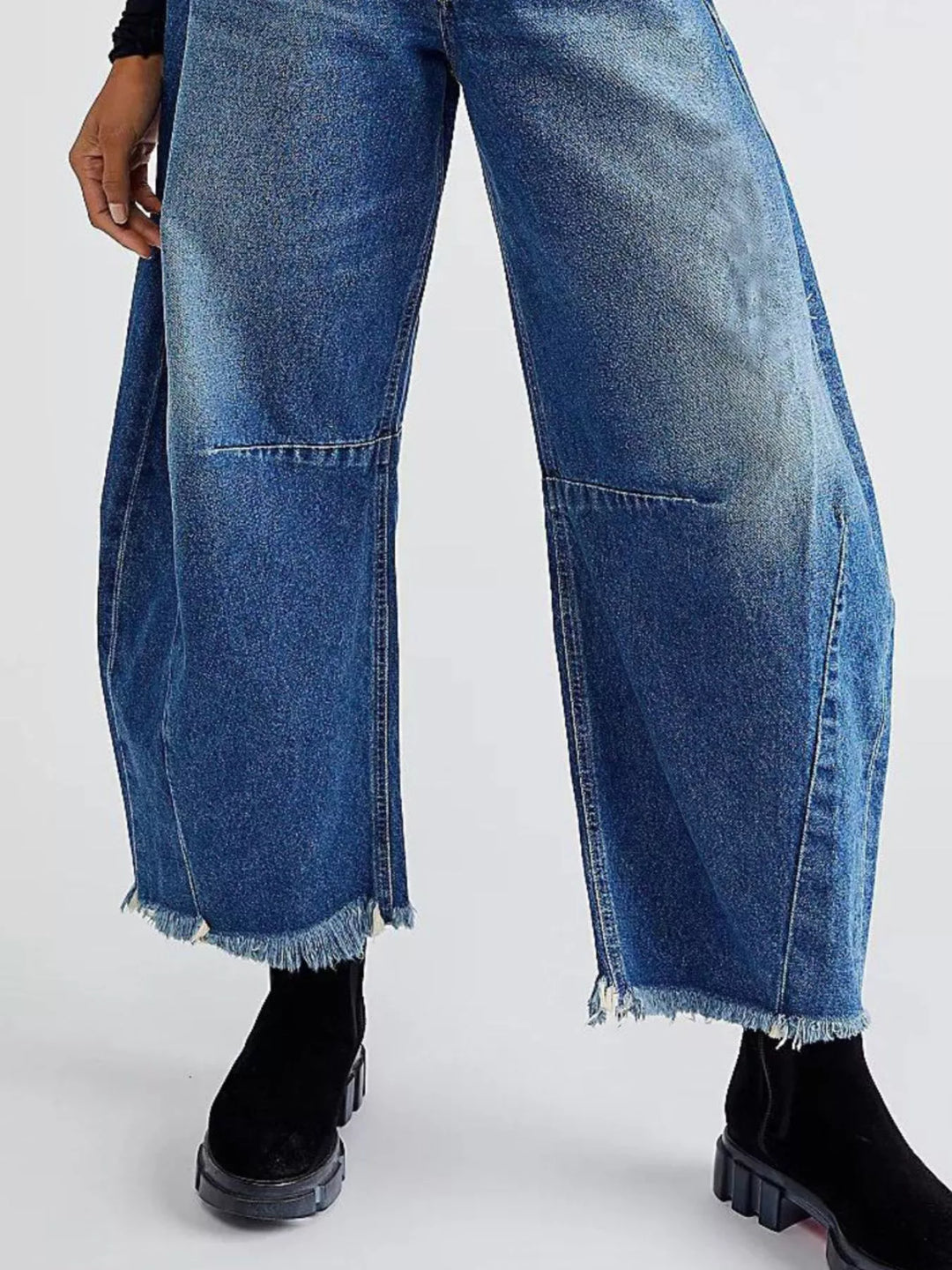 High-rise barrel-leg jeans with raw frayed hem
