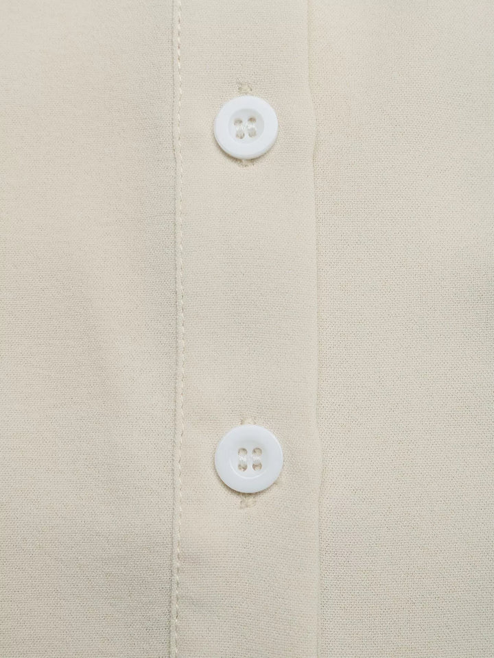 Ruffle sleeve tie-neck button-down blouse