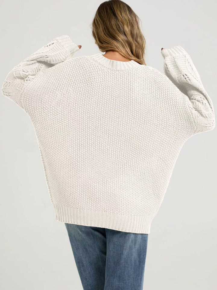 Openwork knit dropped shoulder sweater with curved hem