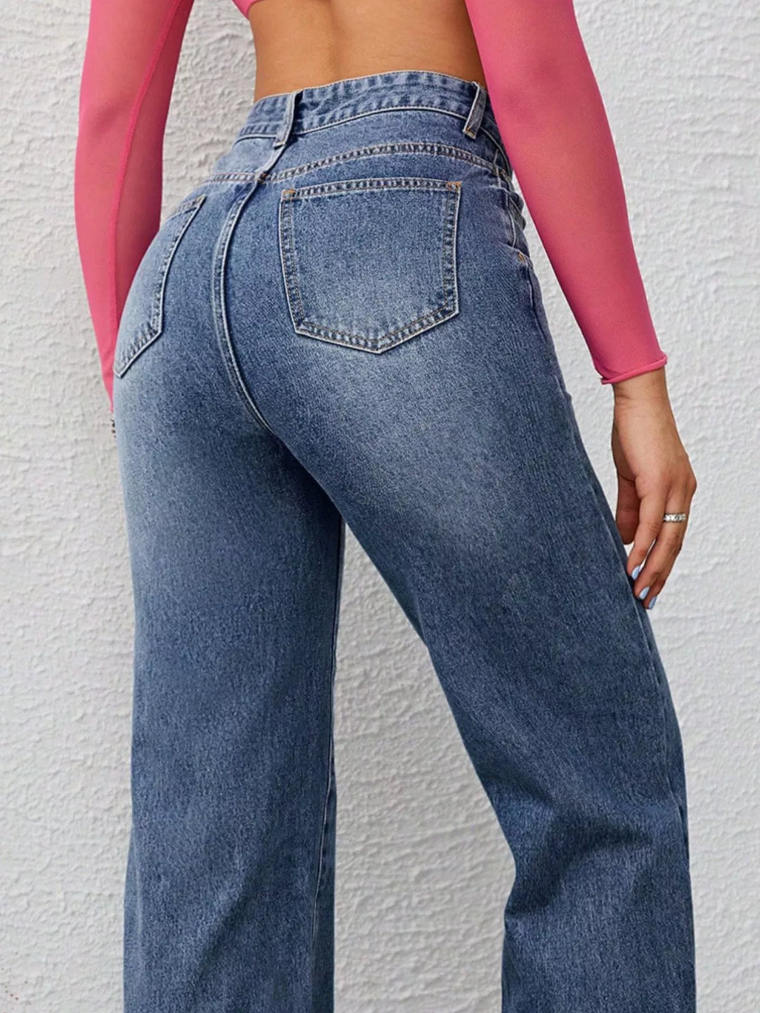 High-rise wide-leg washed jeans with whiskering