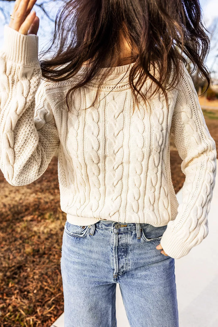 Cable knit drop shoulder sweater with ribbed cuffs