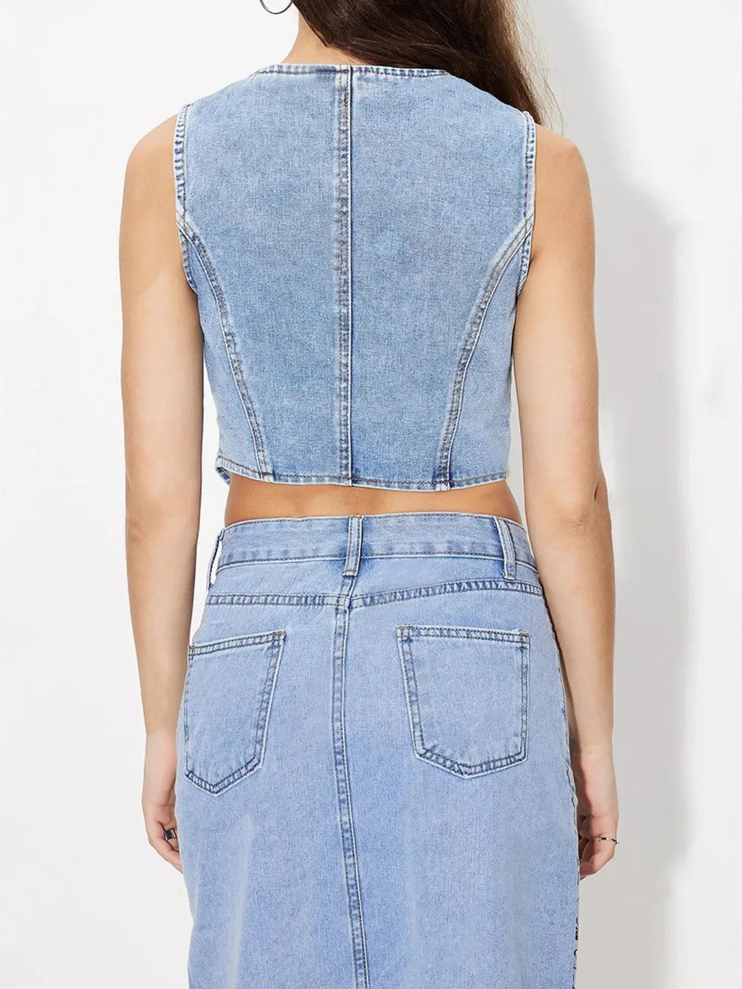 Fitted V-neck button-up denim vest with pointed hem