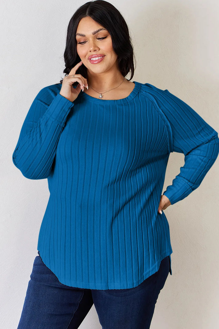 Ribbed knit round neck long sleeve top with side slits