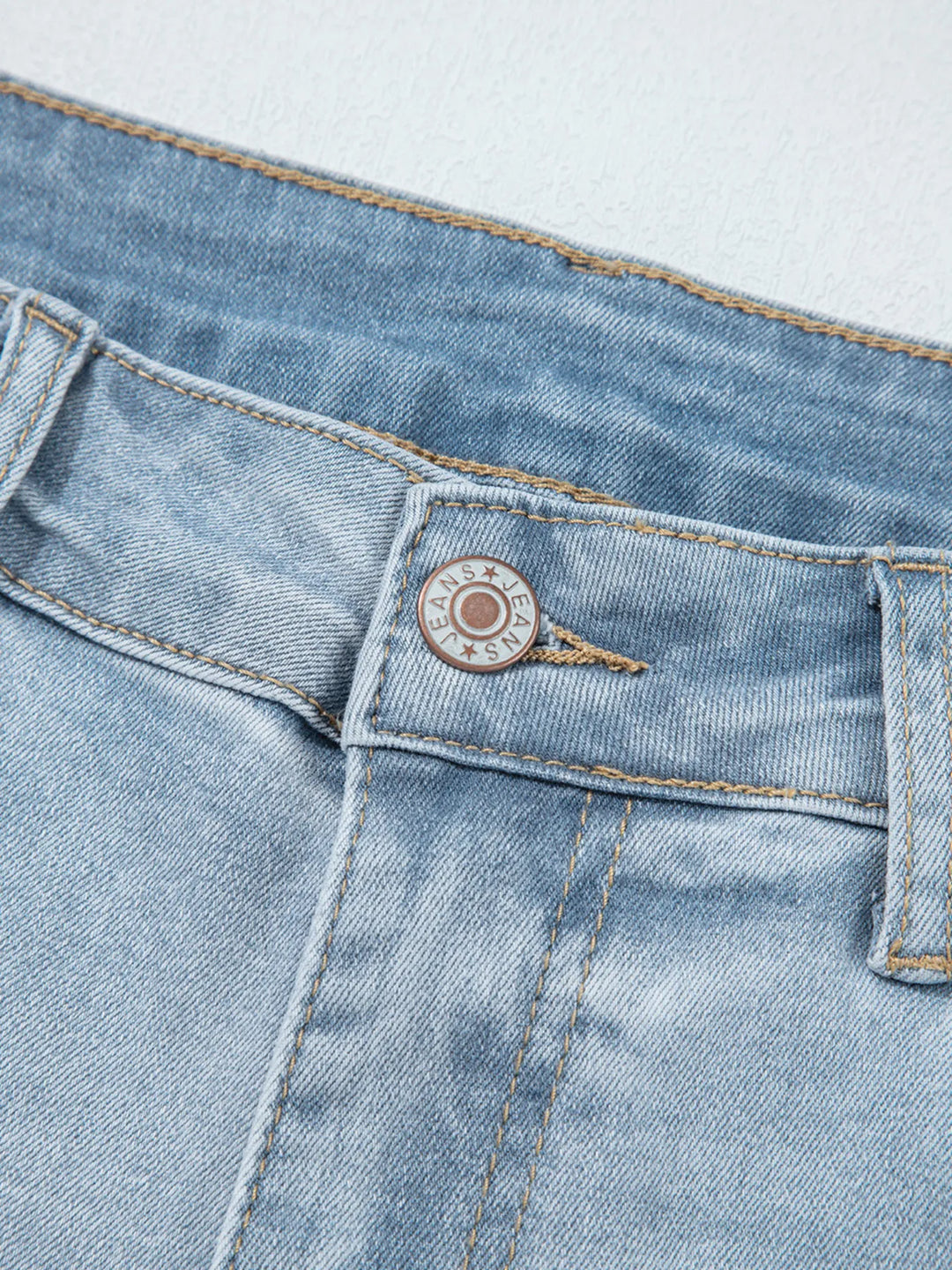 Distressed mid-rise ankle skinny jeans with raw hem