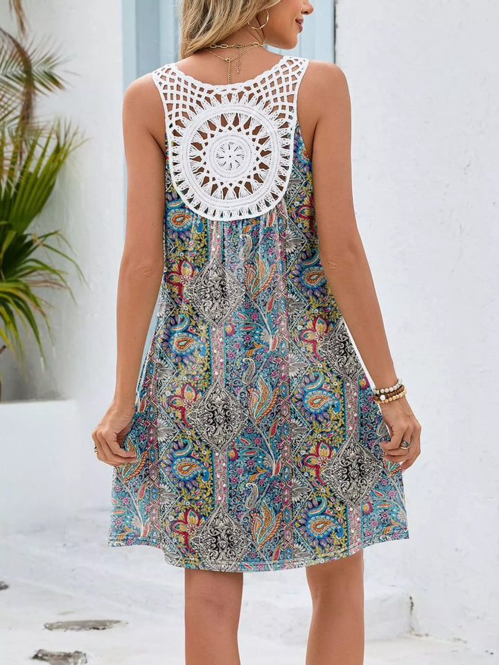 Watercolor floral mini dress with crochet cutout back