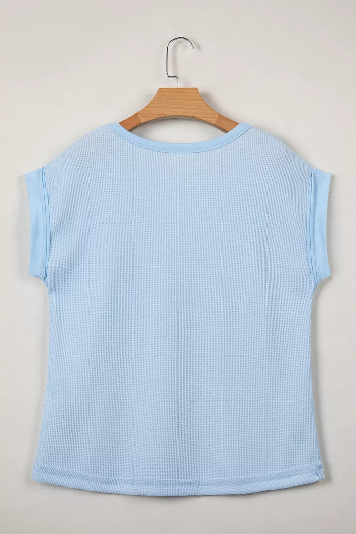 Waffle knit pocket tee with cuffed short sleeves