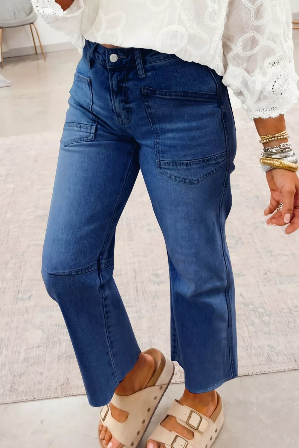High-rise straight-leg jeans with patch pockets and raw hem