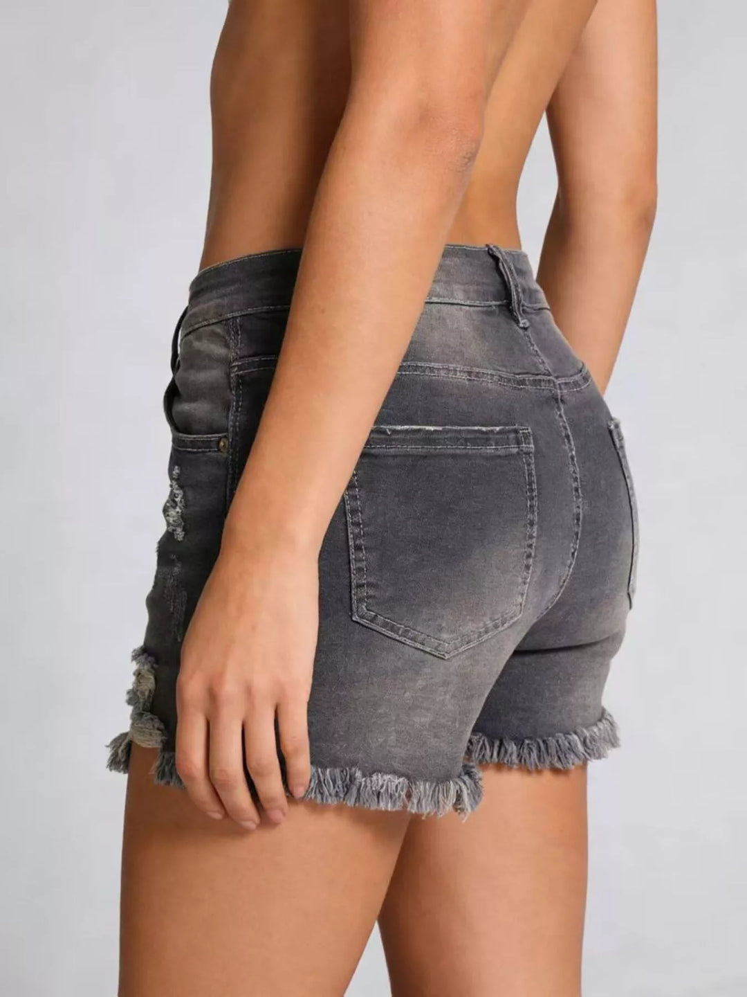 Distressed high-rise denim shorts with frayed raw hem
