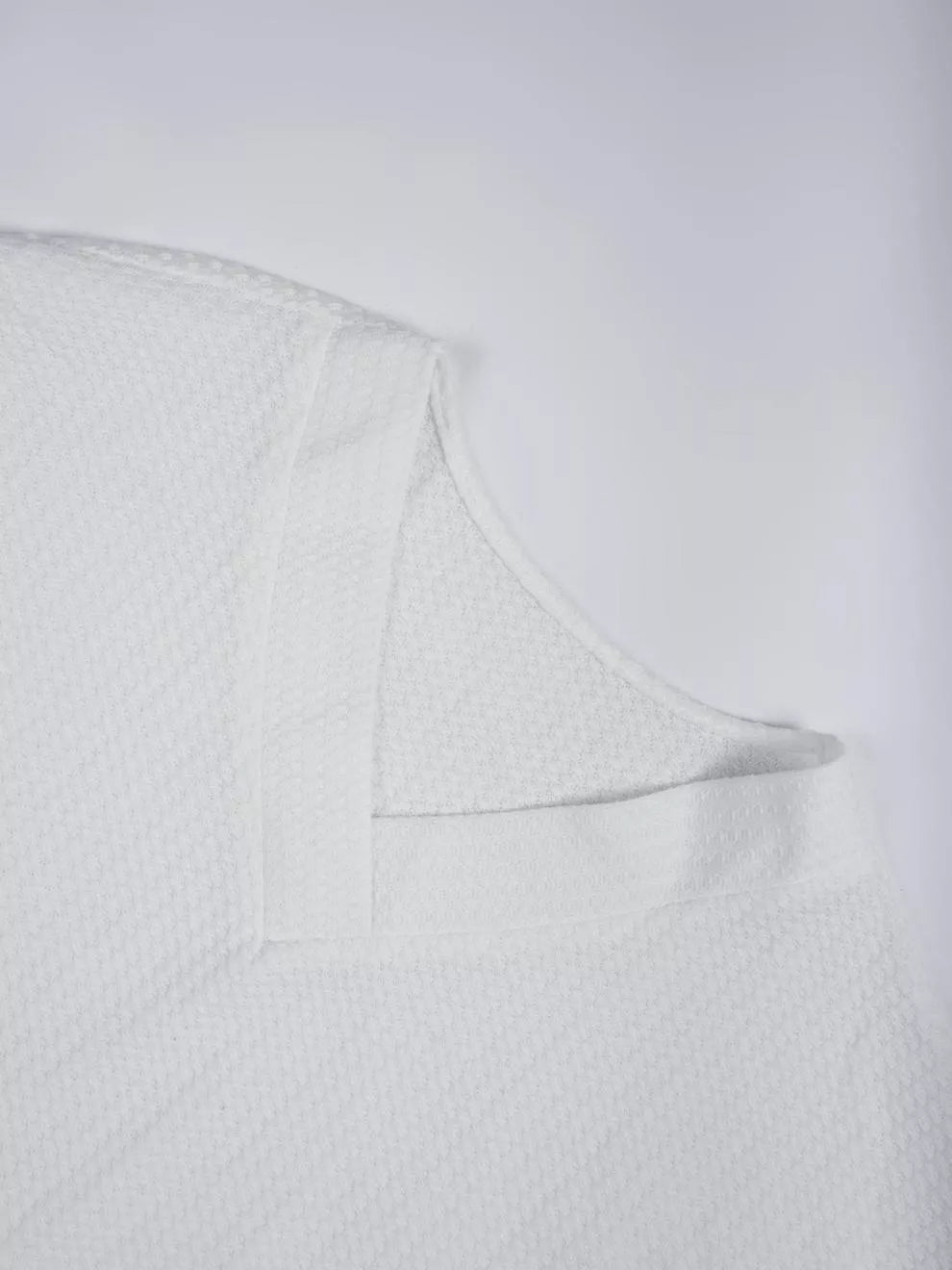 Waffle knit V-neck long sleeve top with ribbed trim