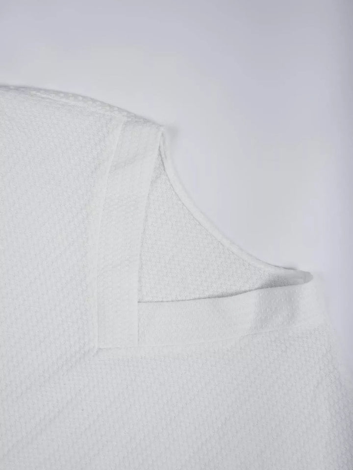 Waffle knit V-neck long sleeve top with ribbed trim