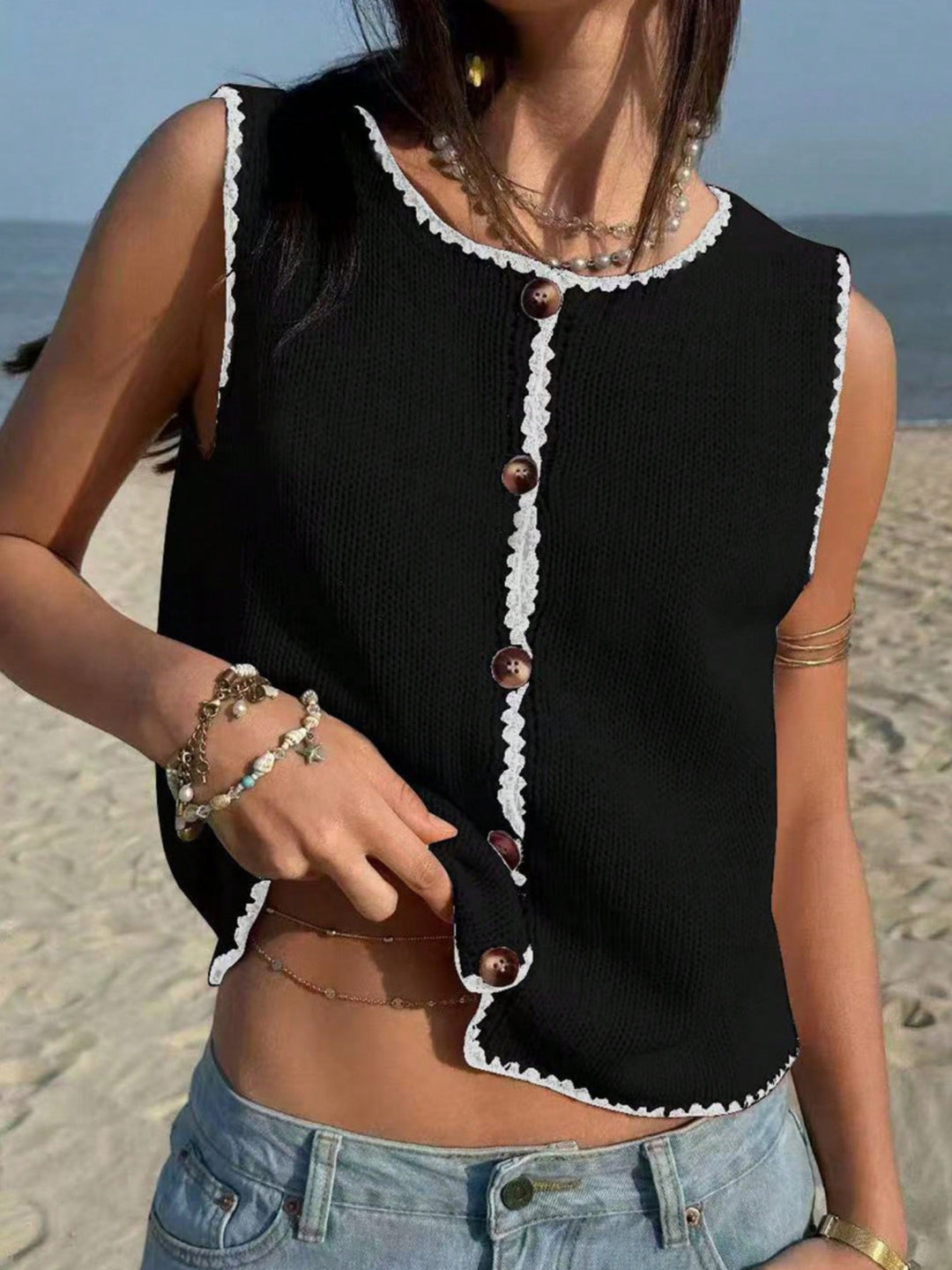 Button-front knit sweater vest with contrast whipstitch trim