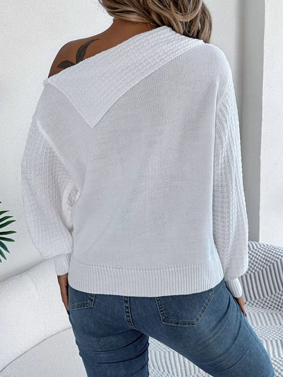Cable knit one-shoulder sweater with fold-over ribbed collar