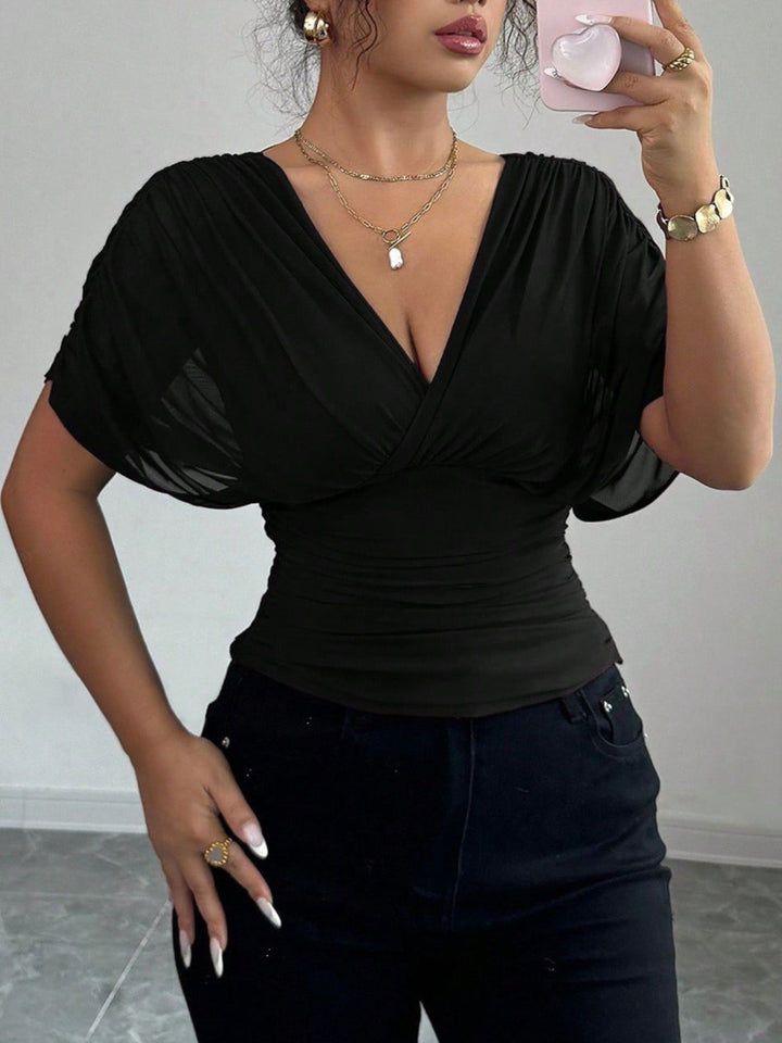 Ruched surplice wrap top with short dolman sleeves