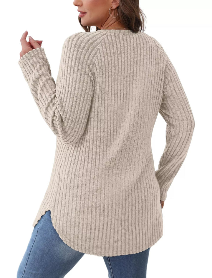 Ribbed knit crew neck long sleeve top with curved hem
