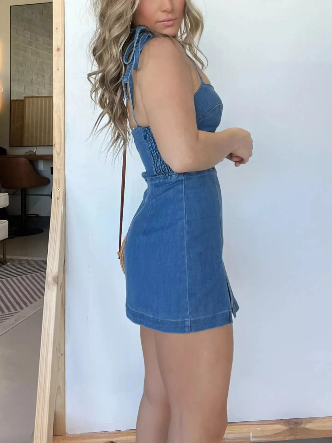 Bustier denim mini dress with tie straps and side slit