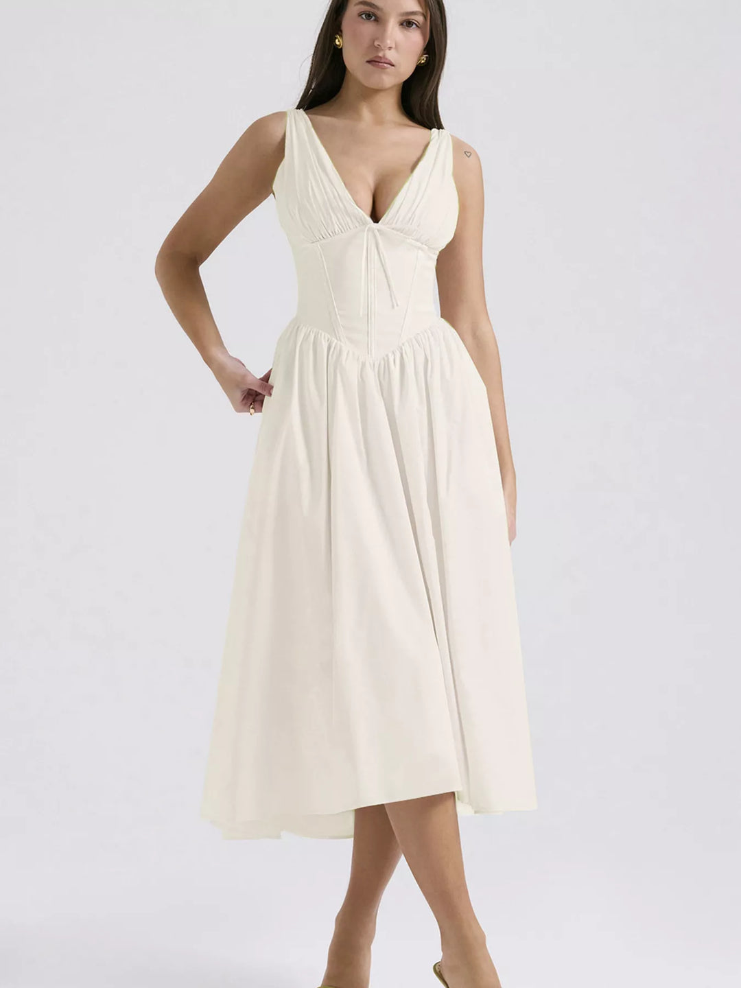 Cream Sleeveless V-neck midi dress with fitted bodice and pockets