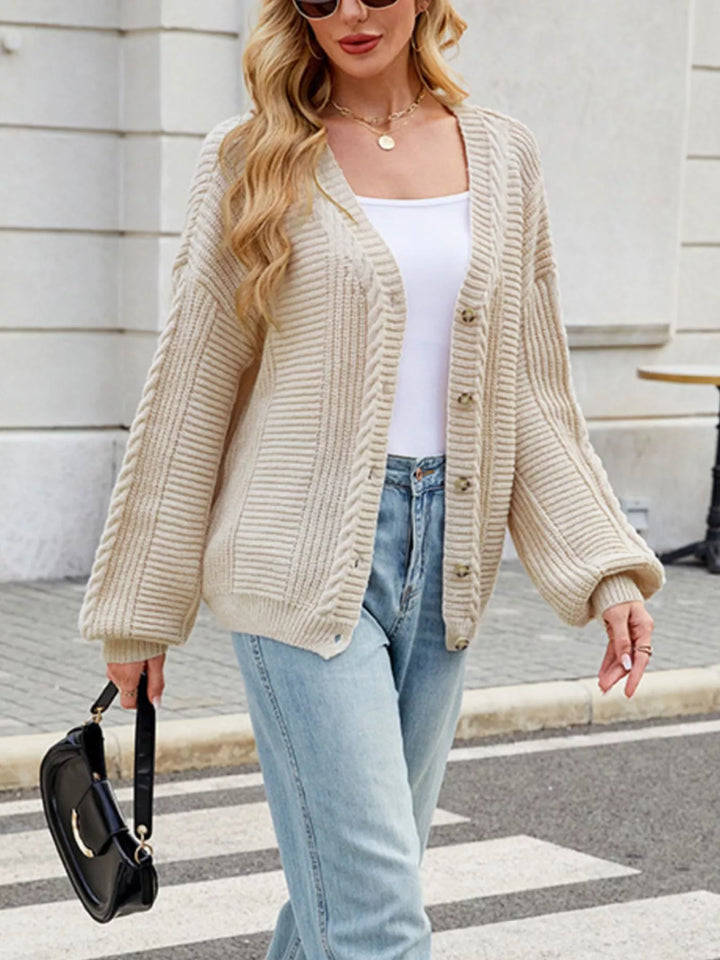 Cable knit button-front cardigan with drop shoulder sleeves
