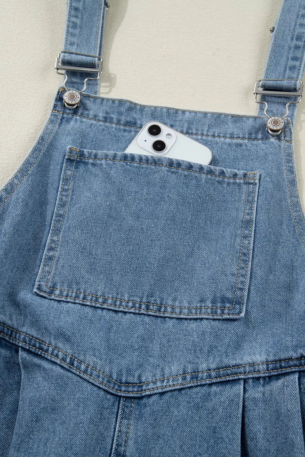 Pleated wide-leg denim overall jumpsuit with bib pocket