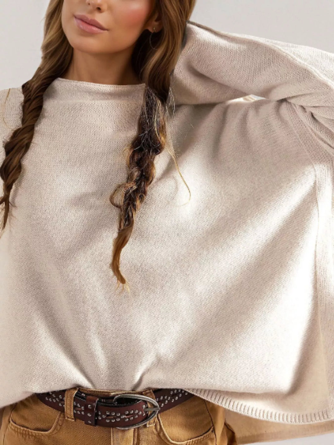 Exposed seam oversized knit sweater with wide sleeves