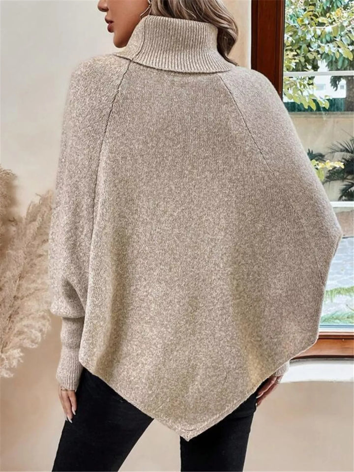 Cable knit turtleneck cape sweater with button shoulder