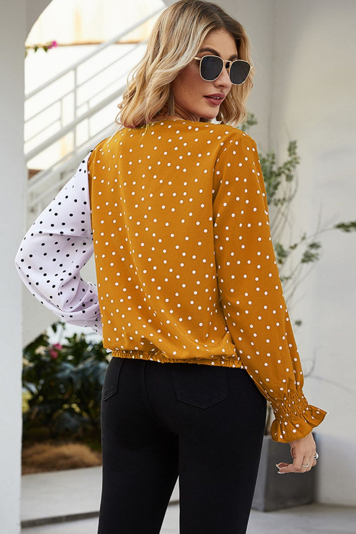Color-block polka dot surplice blouse with lantern sleeves