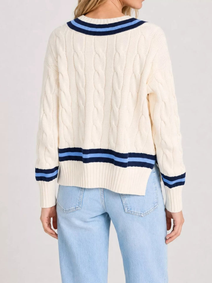 Cable knit v-neck cricket sweater with striped trim