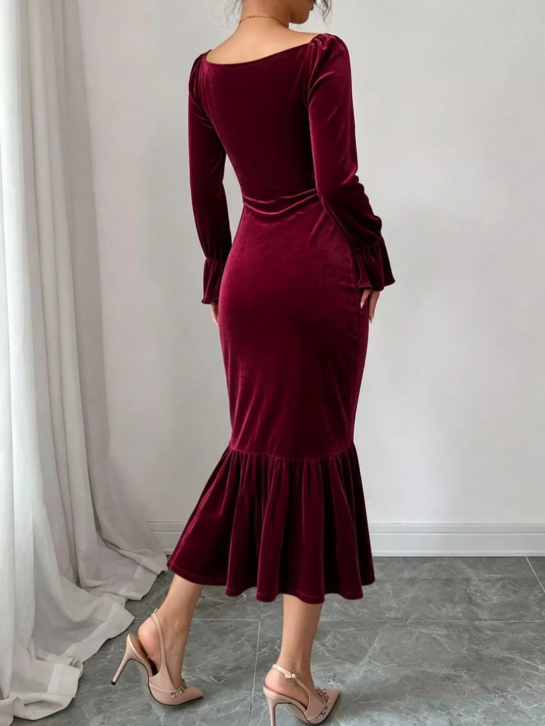 Ruched velvet midi dress with ruffle hem and flared cuffs
