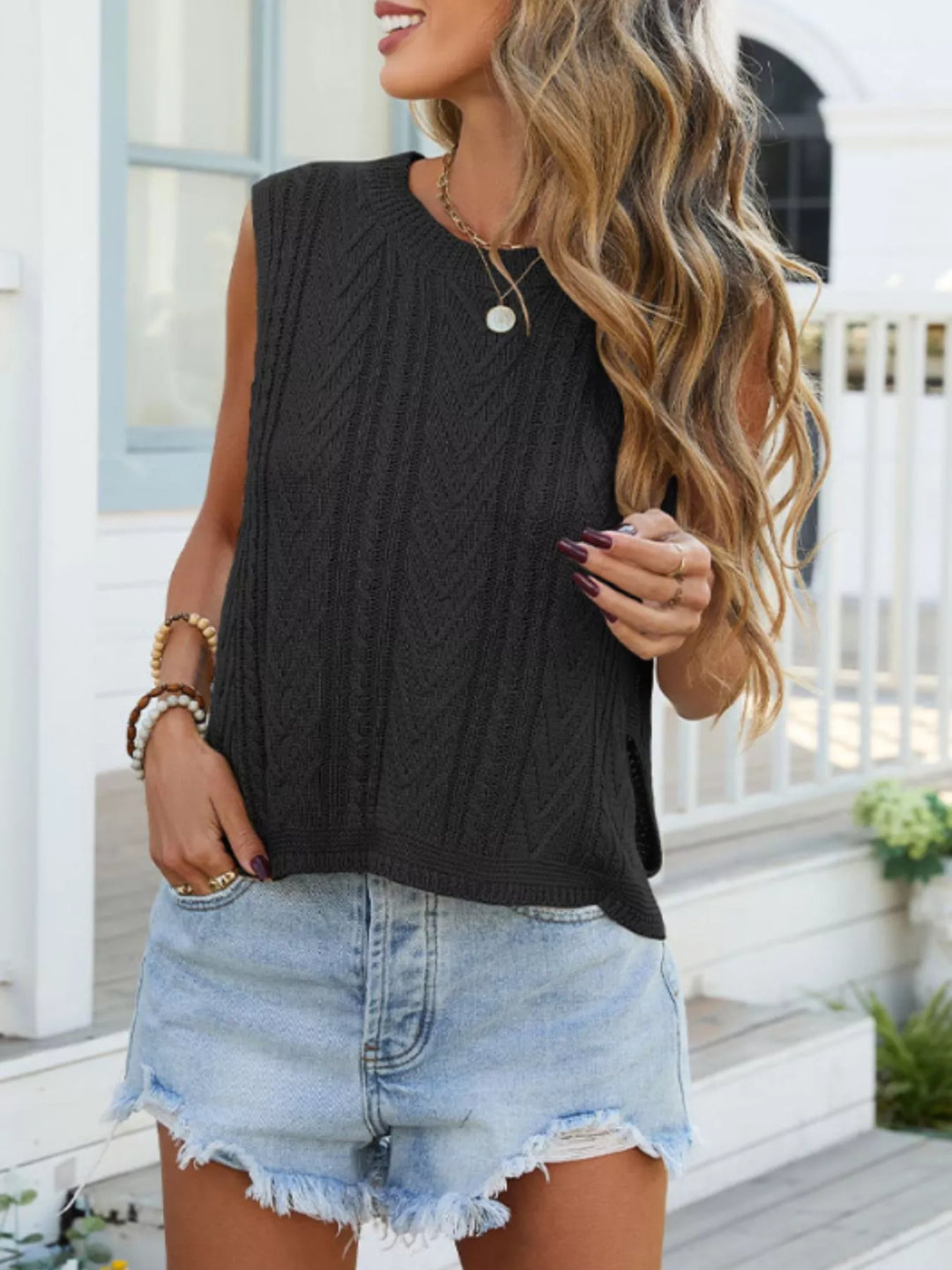 Cable knit sleeveless sweater vest with side slits