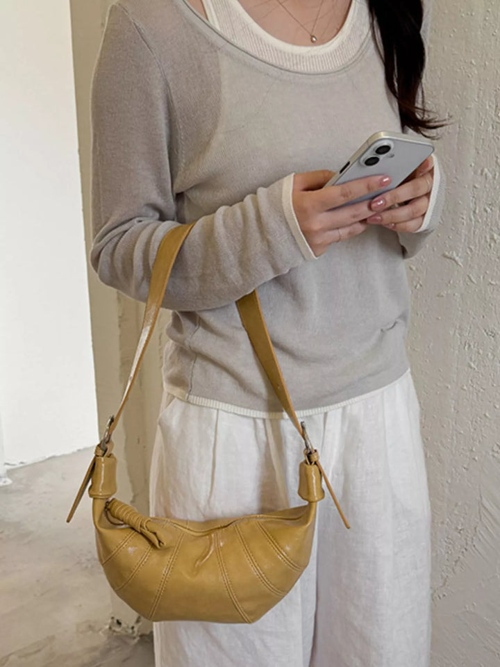 Yellow Croissant crossbody bag with adjustable strap and zip top