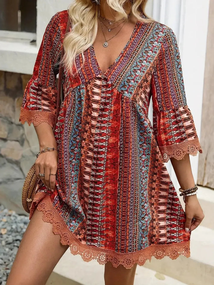 Boho printed mini dress with lace trim and bell sleeves