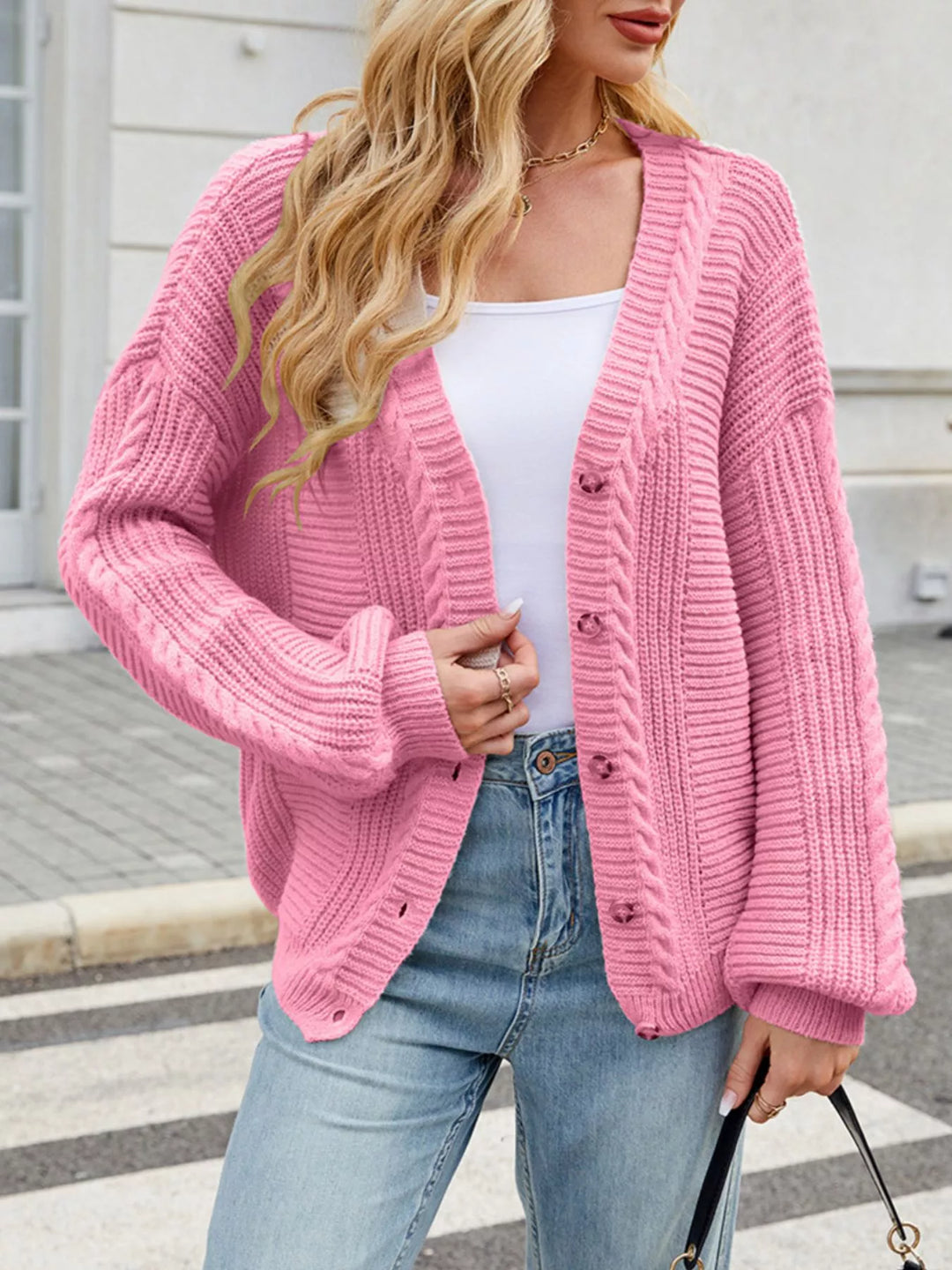 Cable knit button-front cardigan with drop shoulder sleeves