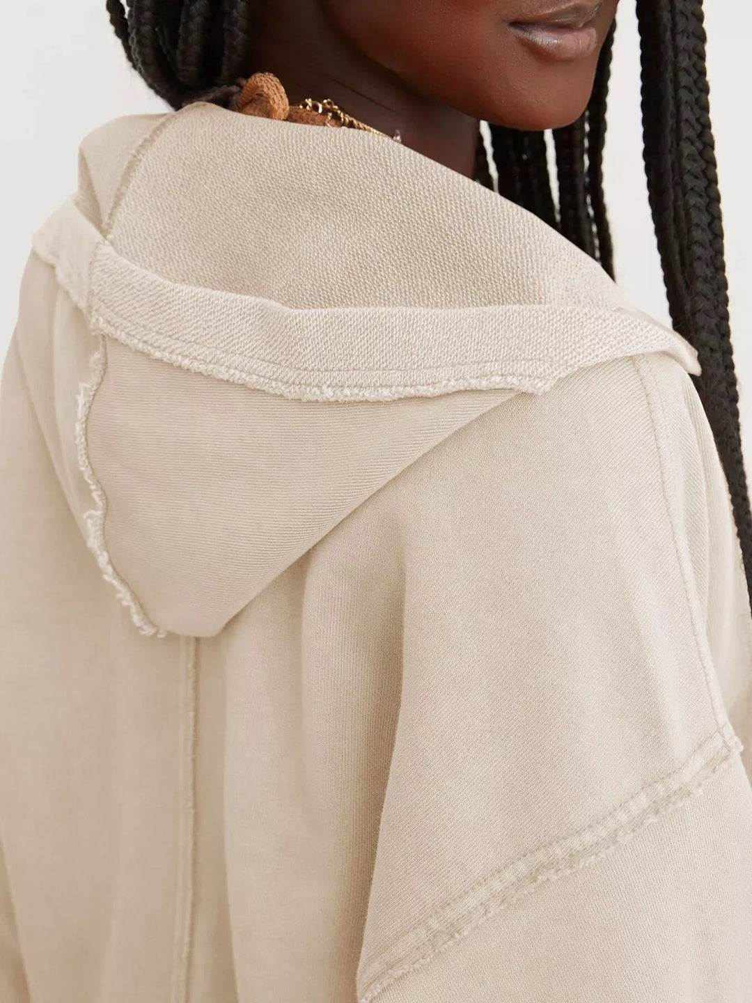 Cropped exposed-seam pullover hoodie with split neck