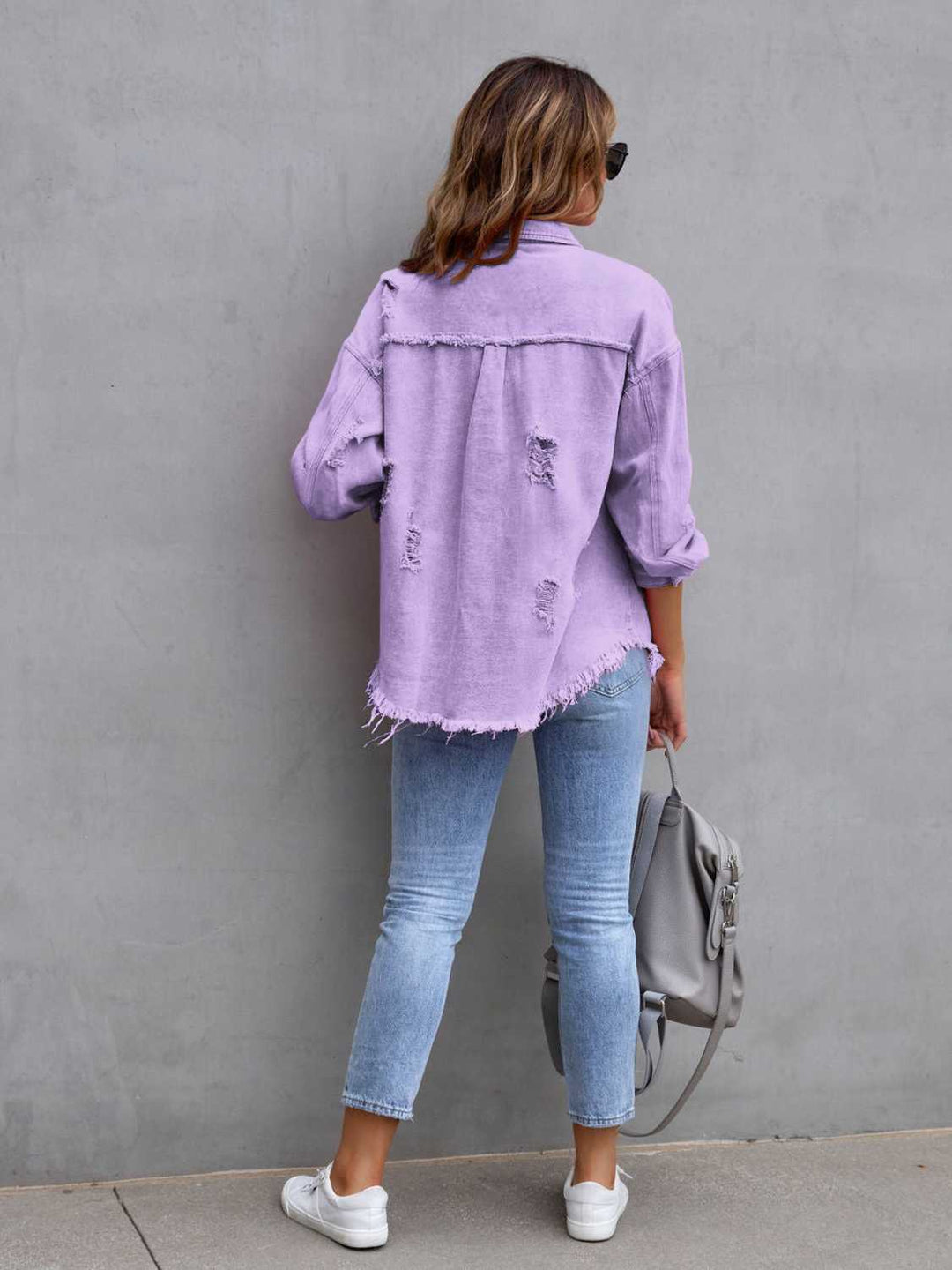 Distressed drop shoulder denim jacket with fringe hem