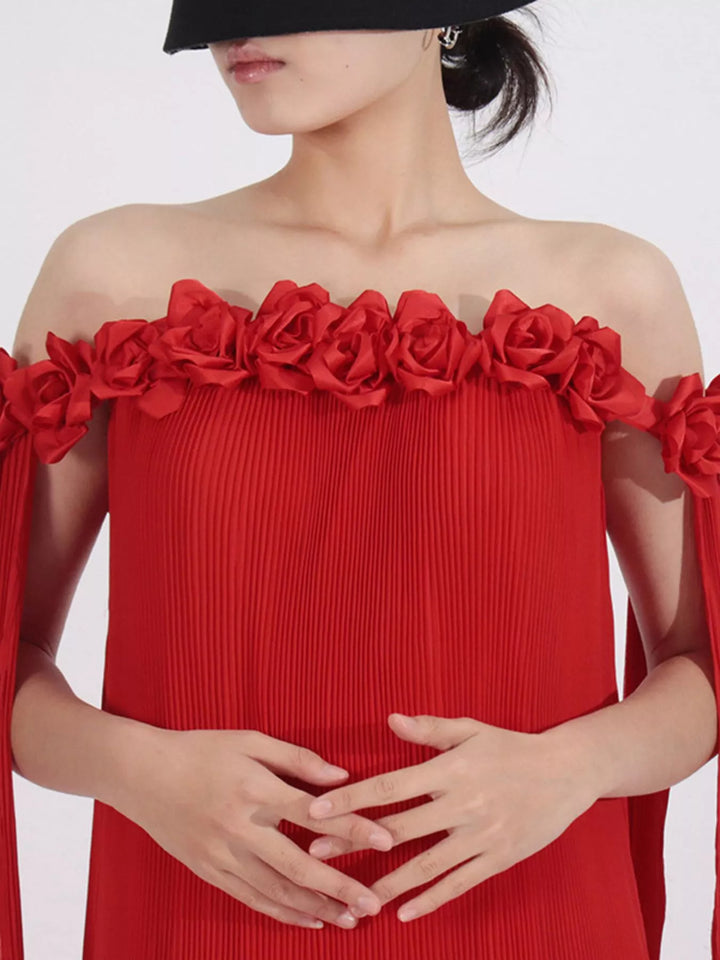 Off-shoulder pleated maxi dress with rosette neckline