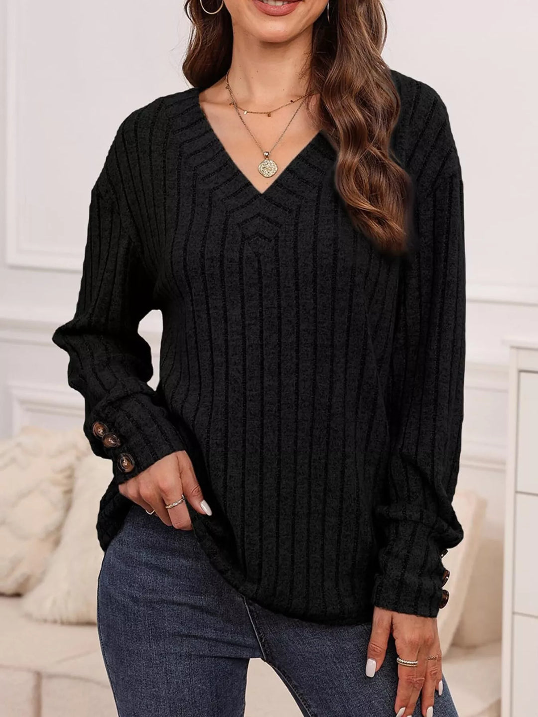 Black Ribbed knit V-neck top with buttoned cuffs